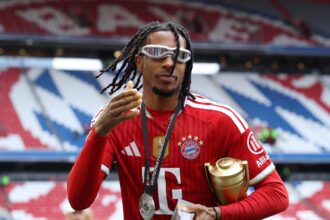 MUNICH, GERMANY - MAY 16: Michael Olise of FC Bayern Munich celebrates with the Bundesliga Player of the Season award after the Bundesliga match between FC Bayern München and 1. FC Köln at Allianz Arena on May 16, 2026 in Munich, Germany. (Photo by Alexander Hassenstein/Getty Images) Getty Images