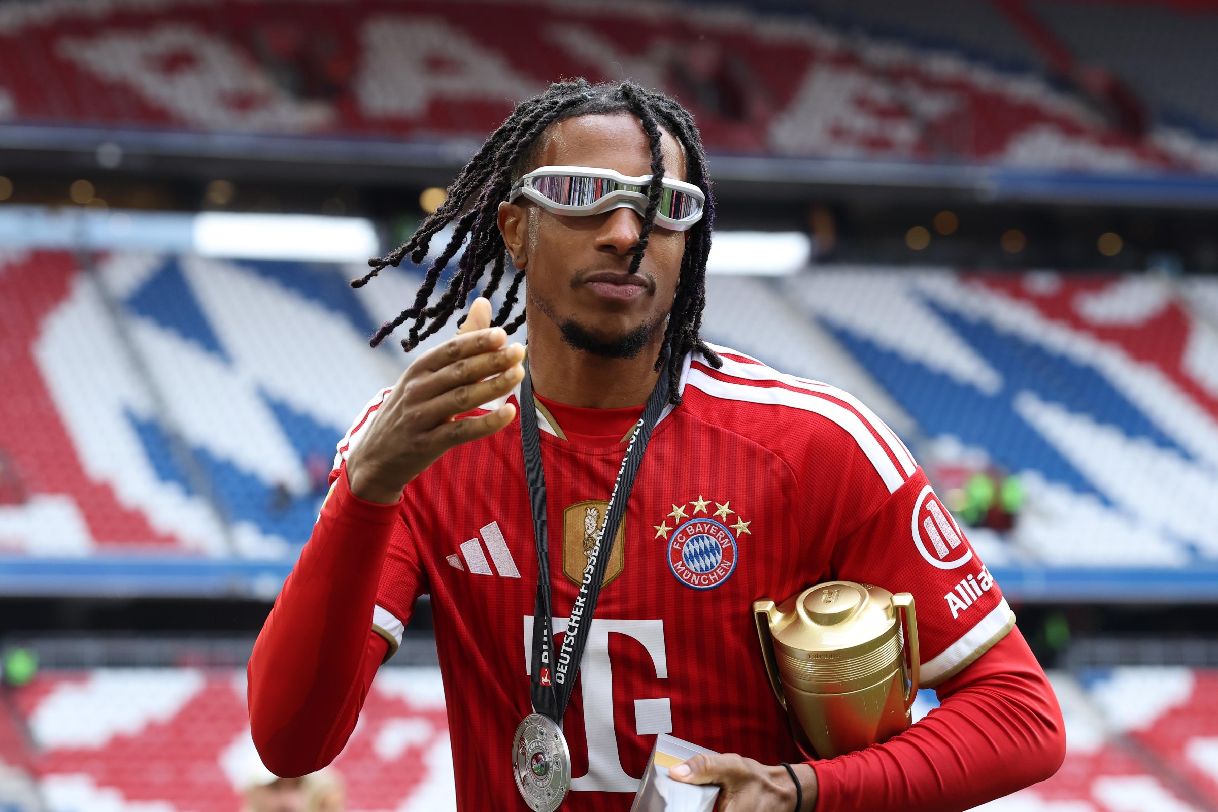 MUNICH, GERMANY - MAY 16: Michael Olise of FC Bayern Munich celebrates with the Bundesliga Player of the Season award after the Bundesliga match between FC Bayern München and 1. FC Köln at Allianz Arena on May 16, 2026 in Munich, Germany. (Photo by Alexander Hassenstein/Getty Images) Getty Images
